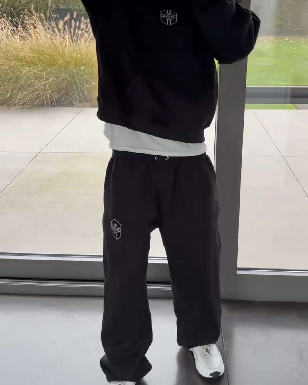 Black BRASIL hoodie and matching joggers shown in a mirror