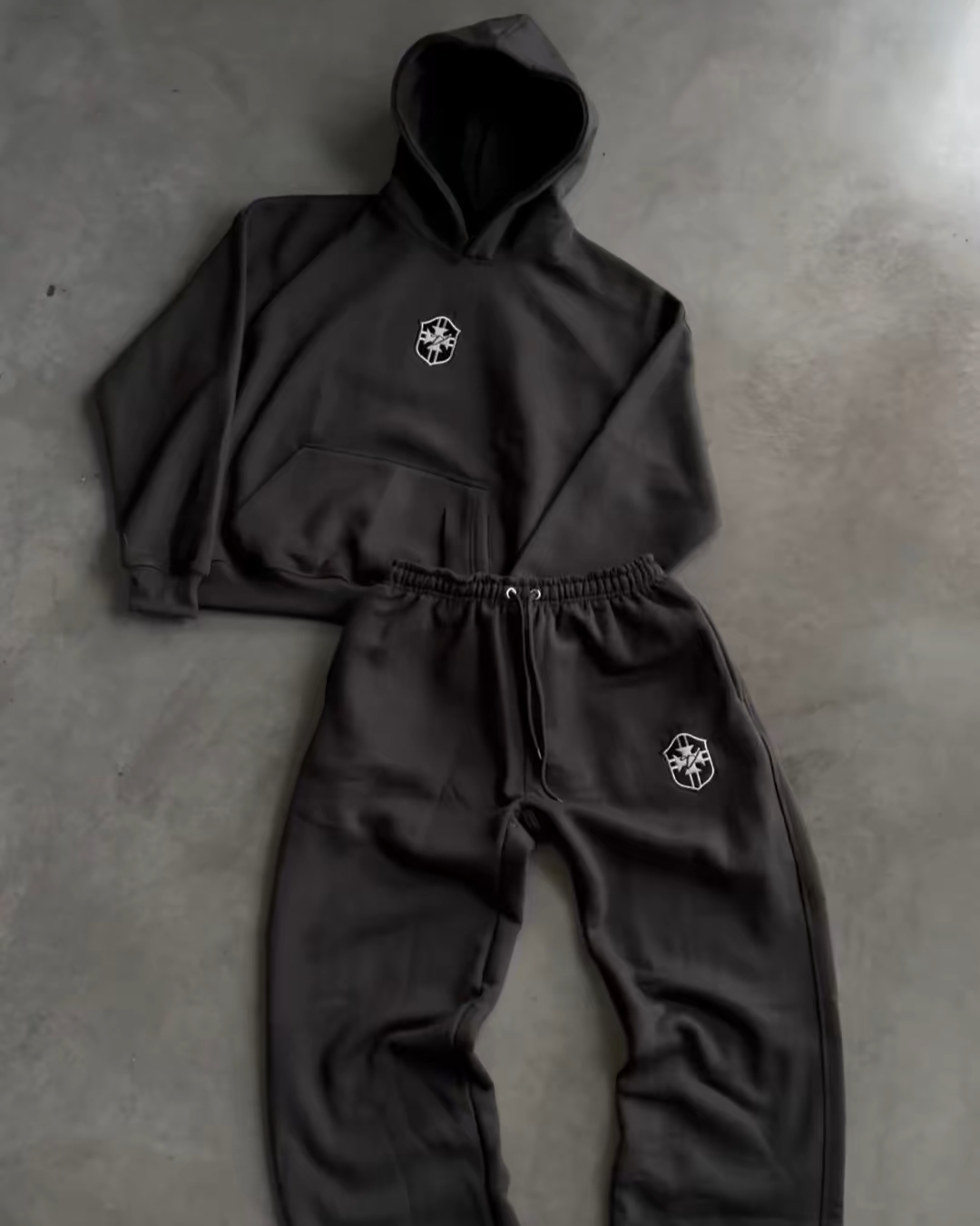 Black BRASIL pullover hoodie and drawstring joggers laid flat