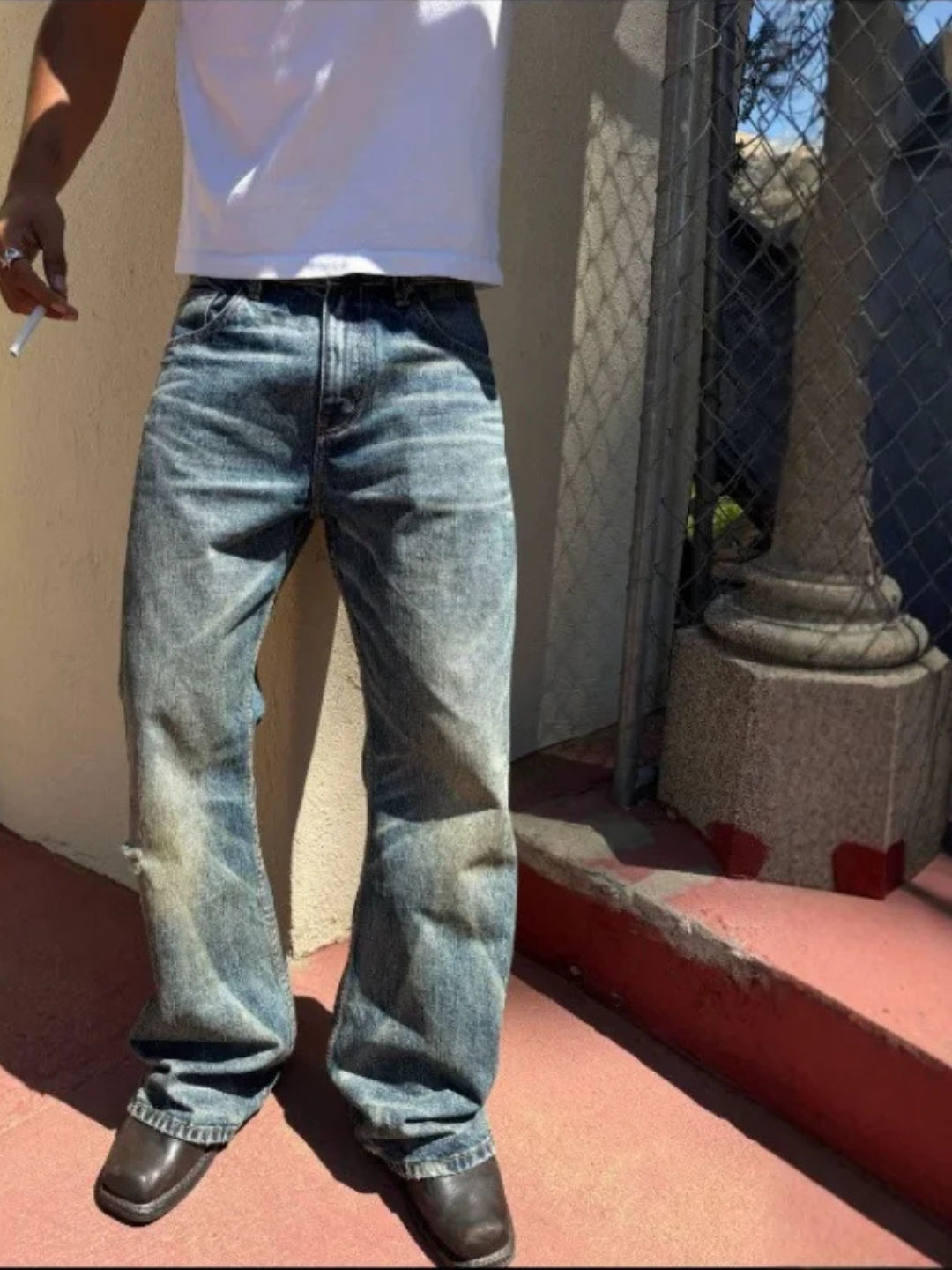 WORN — FLARED JEANS — blue washed flared jeans on model, front fit view