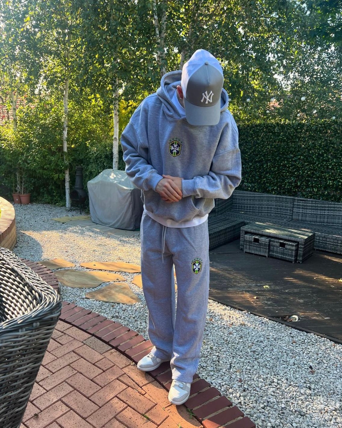 Grey BRASIL hoodie and matching joggers worn outdoors