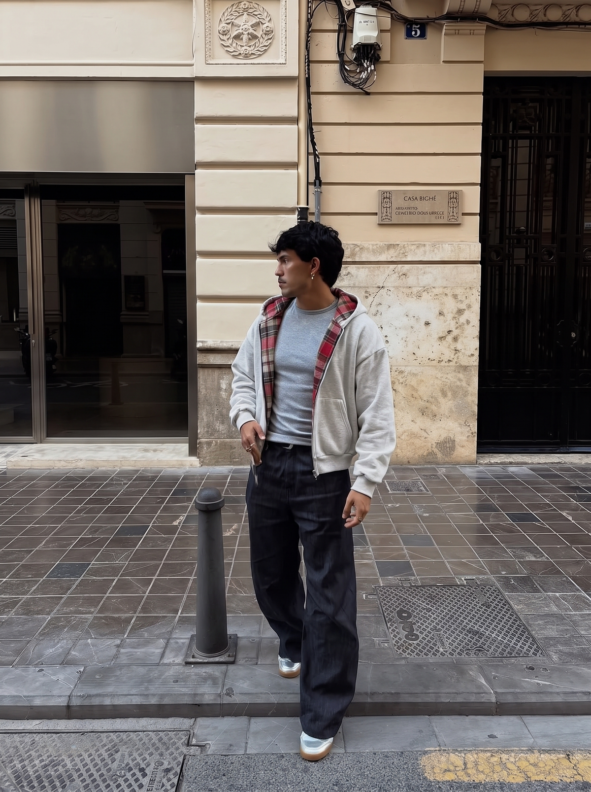 REVERSO — CHECK HOODIE JACKET — grey jacket with red check lining on model outdoors
