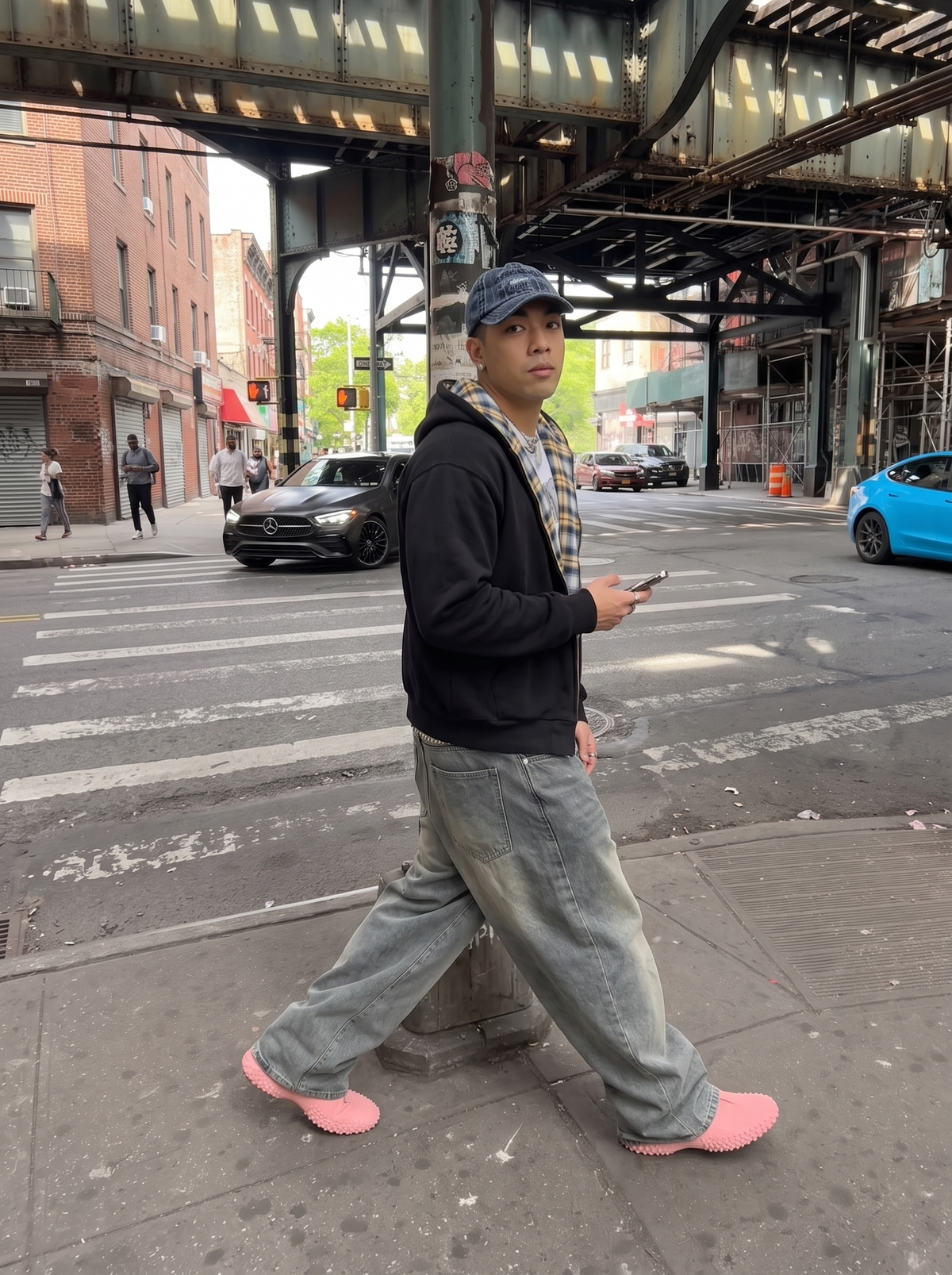 REVERSO — CHECK HOODIE JACKET — black jacket with yellow check lining on model crossing street