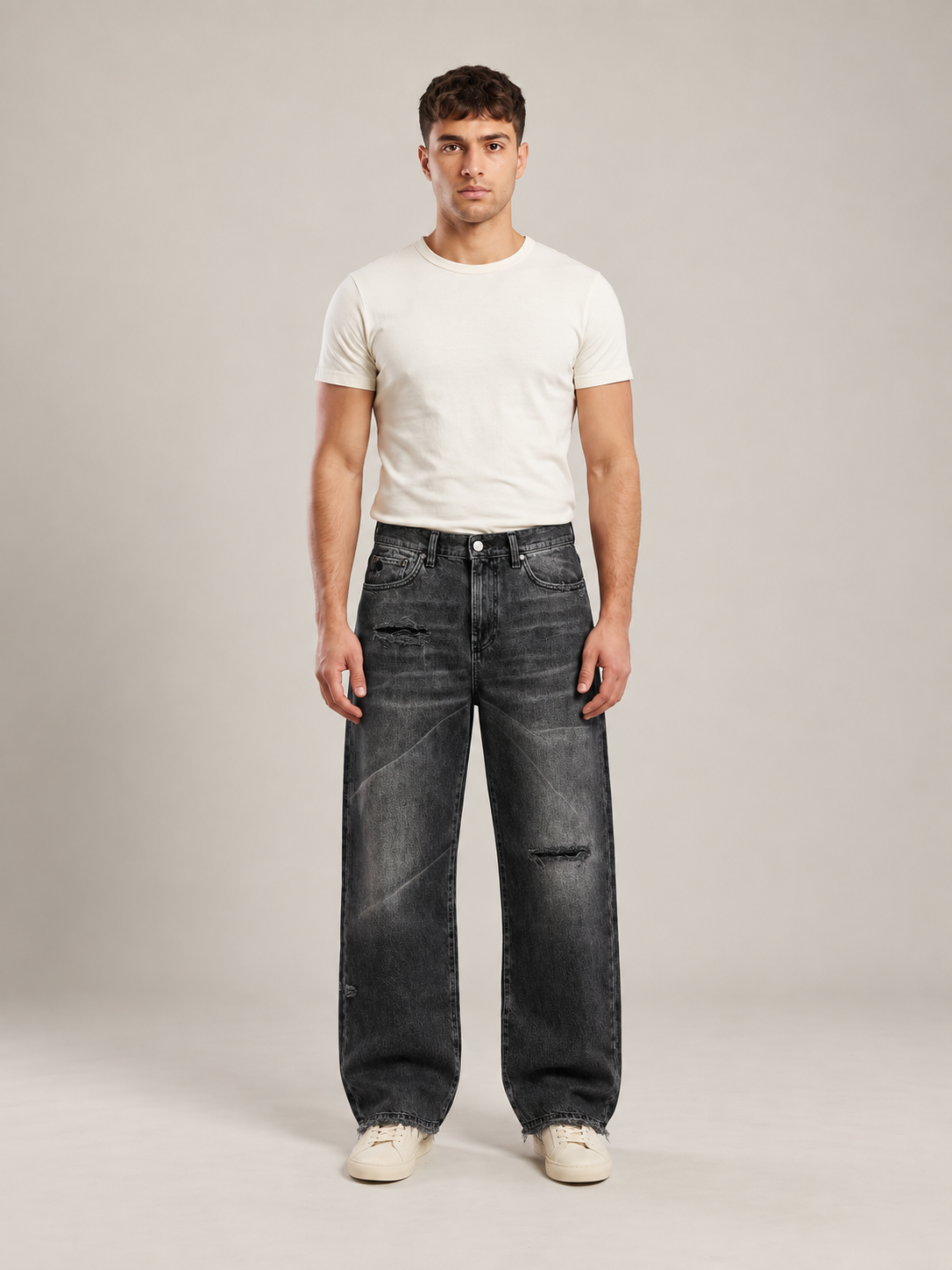 Black Shadow loose-fit washed jeans — front studio view on model